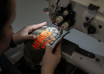 Demand for camouflage hats emblazoned with 'Harris-Walz' has soared, and one New Jersey factory is working overtime to meet it / ©AFP