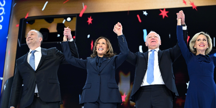 Kamala Harris, pictured here with running mate Tim Walz and their spouses at the Democratic National Convention, has been under pressure to do a media interview since launching her campaign last month / ©AFP