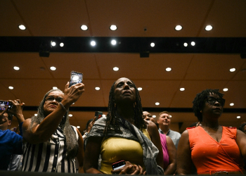 Attendees listen to US President Joe Biden and Vice President Kamala Harris speak in the overflow room at Prince George's Community College in Largo, Maryland -- Black voters in attendance said they were fired up about Harris's White House run / ©AFP