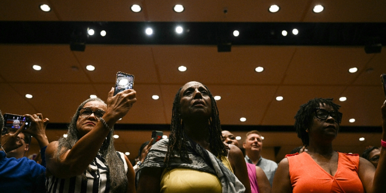 Attendees listen to US President Joe Biden and Vice President Kamala Harris speak in the overflow room at Prince George's Community College in Largo, Maryland -- Black voters in attendance said they were fired up about Harris's White House run / ©AFP