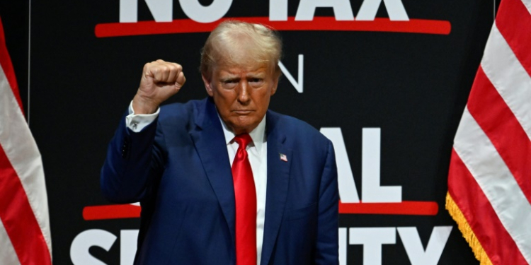 Republican presidential candidate Donald Trump pumps his fist after speaking at a campaign rally in Asheville, North Carolina on August 14, 2024. ©AFP