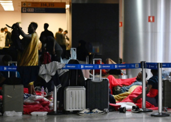 Travelers from India and Vietnam are in limbo at Sao Paulo's Guarulhos Airport. ©AFP