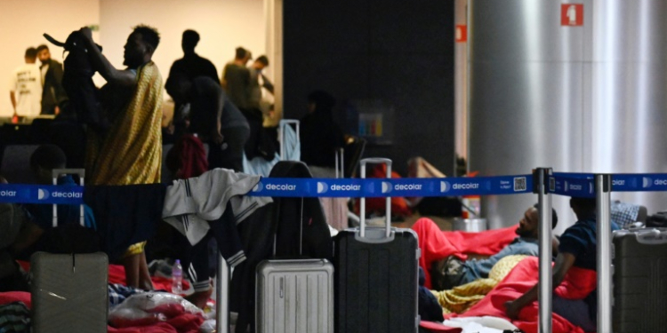 Travelers from India and Vietnam are in limbo at Sao Paulo's Guarulhos Airport. ©AFP