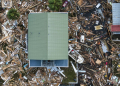 An aerial view shows damaged houses in Horseshoe Beach, Florida, on September 28, 2024 after the passage of Hurricane Helene . ©AFP