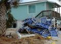 Beach chairs are piled up after Hurricane Helene hit Treasure Island with high surge waters . ©AFP