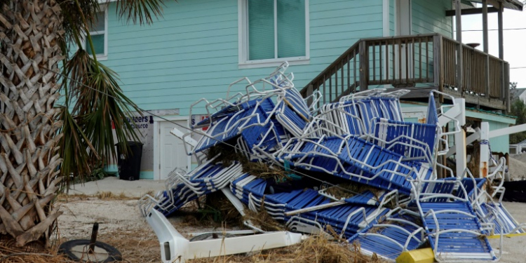 Beach chairs are piled up after Hurricane Helene hit Treasure Island with high surge waters . ©AFP