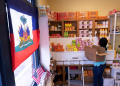 Creations Market shop owner Philomene Philostin, a naturalized US citizen of Haitian origin, shelves merchandise in her store that caters mainly to Haitian residents in Springfield, Ohio, on September 13, 2024 / ©AFP