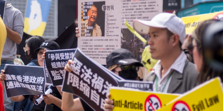 Hong Kong people living in Taiwan display placards and a poster showing detained pro-democracy media tycoon Jimmy Lai at a rally in Taipei in March 2024  / ©AFP