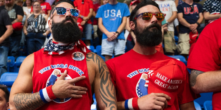 Nick Passano (L), a cryptocurrency investor, says he likes Donald Trump because he represents men / ©AFP