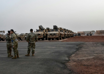 Military vehicles that will be boarded onto a cargo plane as part of US troops' departure from Niger are seen in Niamey in June 2024 . ©AFP