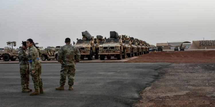 Military vehicles that will be boarded onto a cargo plane as part of US troops' departure from Niger are seen in Niamey in June 2024 . ©AFP