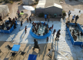 Displaced Syrian children play in swimming pools set up by the Smile Younited charity in the rebel-held part of Aleppo province on July 27, 2024. ©AFP