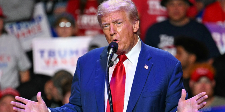 Former US president Donald Trump ramped up attacks on rival Kamala Harris during a campaign rally in Pennsylvania, claiming she is unleashing a 'flood' of migrants into the state's cities and towns / ©AFP