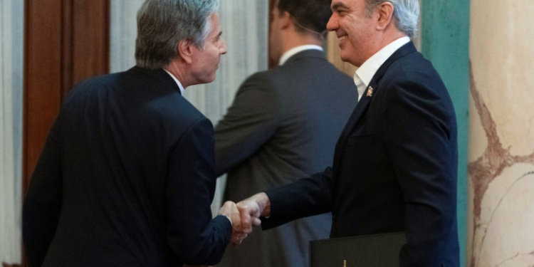 US Secretary of State Antony Blinken shakes hands with President of the Dominican Republic Luis Abinader after a joint news conference at the National Palace in Santo Domingo. ©AFP