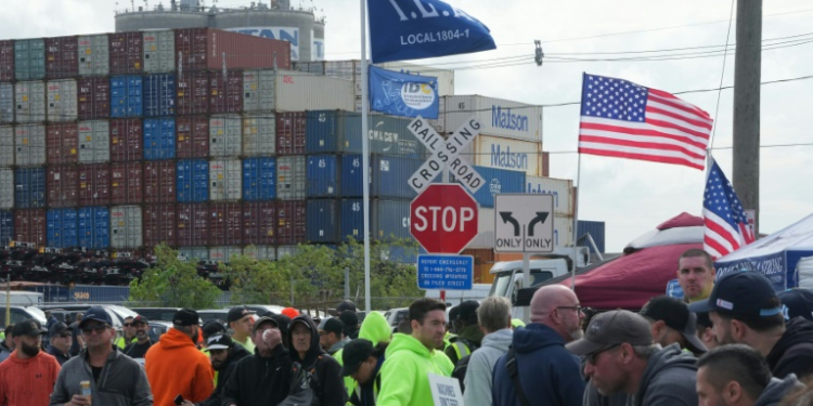 Shipping containers are stacked as dockworkers are on strike in Port Newark on October 1, 2024 in New Jersey. ©AFP