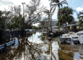 A flooded street with debris in the aftermath of Hurricane Milton in Siesta Key, Florida, where the storm made landfall / ©AFP