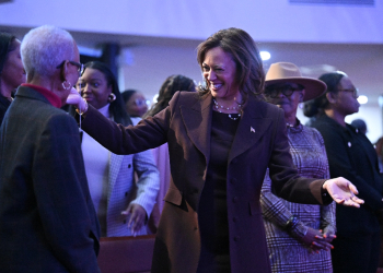 Kamala Harris greets congregants after speaking at the Church of Christian Compassion during a stop part of the campaign's 'Souls to the Polls' push, in Philadelphia / ©AFP