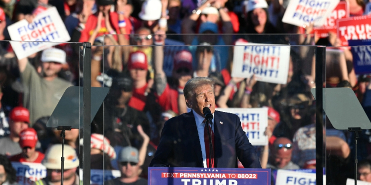 Republican presidential candidate Donald Trump addressed the rally in Butler, Pennsylvania from behind bulletproof glass amid security concerns following two assassination attempts  / ©AFP