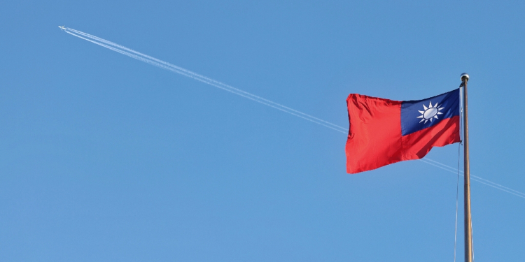 A Taiwan flag flies over the capital, Taipei, in October 2024. The self-ruled island is closely watching the US election for signs of policy shifts that could impact tensions with China / ©AFP