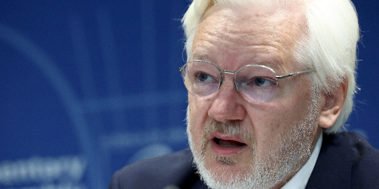 Assange said free speech protections were 'reinterpreted away' in his case / ©AFP