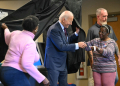 US President Joe Biden is handed an 'I Voted' sticker as he steps out of the booth after casting his ballot early in Delaware  / ©AFP