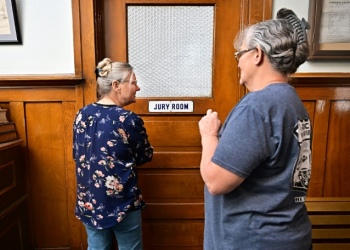 Esmeralda County clerk Cindy Elgan (L) and deputy clerk Lori Baird stand at the doorway to where ballots are kept in the historic Esmeralda County courthouse in Goldfield, Nevada. ©AFP