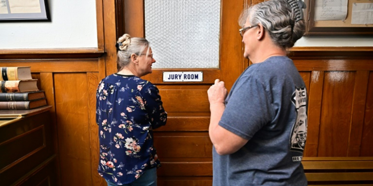 Esmeralda County clerk Cindy Elgan (L) and deputy clerk Lori Baird stand at the doorway to where ballots are kept in the historic Esmeralda County courthouse in Goldfield, Nevada. ©AFP