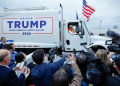 Republican presidential nominee Donald Trump holds a press conference from inside trash hauler at Green Bay Austin Straubel International Airport on October 30, 2024 in Green Bay, Wisconsin. ©AFP