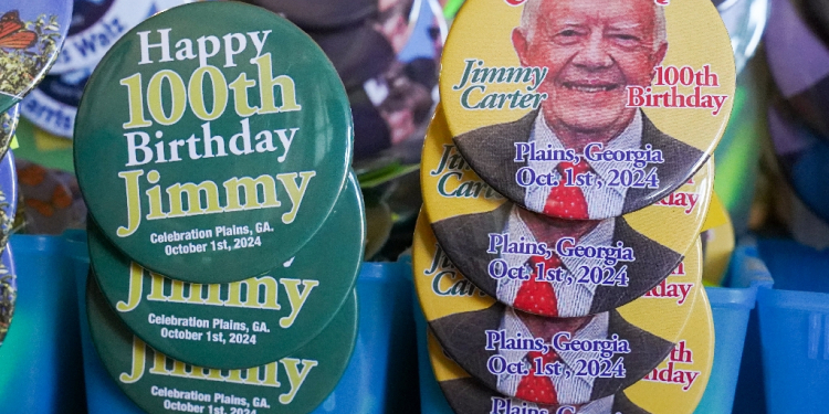 Buttons celebrating former US president Jimmy Carter's birthday are seen at the Plains Peanut Festival on September 28, 2024, in Plains, Georgia / ©AFP