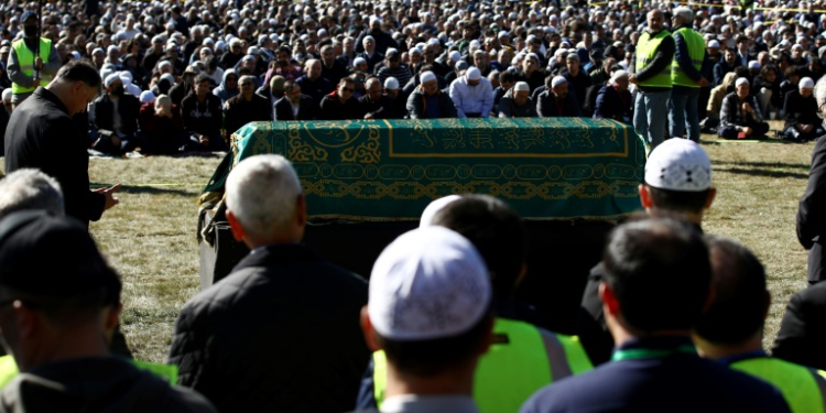 People pray over the casket of Turkish Muslim cleric Fethullah Gulen during a service at Skylands Stadium in Augusta, New Jersey. ©AFP