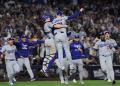 The Los Angeles Dodgers celebrate after clinching a stunning World Series victory over the New York Yankees on Wednesday. ©AFP