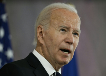 US President Joe Biden speaks after being awarded with the Grand Cross special class of the Order of Merit in Berlin. ©AFP