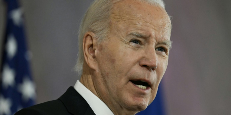 US President Joe Biden speaks after being awarded with the Grand Cross special class of the Order of Merit in Berlin. ©AFP