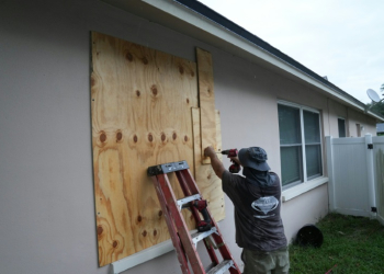 A resident boards up his windows in Palm Harbor, Florida, ahead of Hurricane Milton's expected mid-week landfall . ©AFP