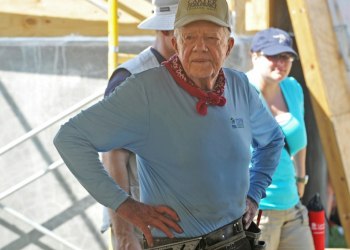 Former US president Jimmy Carter, shown here helping to build a house for earthquake victims in Haiti in 2012, has lived long enough to cast his vote for Kamala Harris in November's election. ©AFP