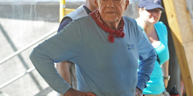 Former US president Jimmy Carter, shown here helping to build a house for earthquake victims in Haiti in 2012, has lived long enough to cast his vote for Kamala Harris in November's election. ©AFP