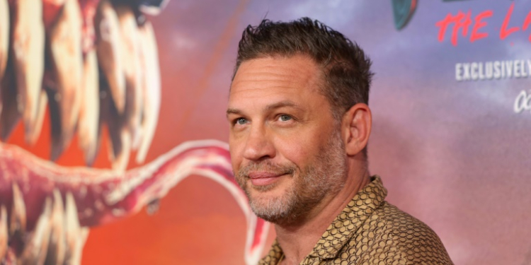 Tom Hardy, star of 'Venom: The Last Dance,' is seen before a poster of the film at its New York premiere on October 21, 2024 . ©AFP