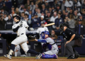 New York's Anthony Volpe hits a grand slam home run to put the Yankees ahead to stay in a World Series victory over the Los Angeles Dodgers. ©AFP