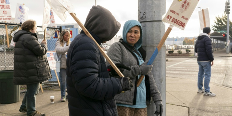 Boeing factory workers remain on strike after rejecting the company's latest contract offer on October 23 . ©AFP