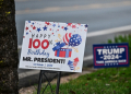 As crowds gathered for Carter's 100th birthday this week, observers could see what might seem like a contradiction anywhere else: signs celebrating Carter in the same yard as placards for Trump's presidential campaign / ©AFP