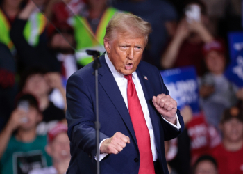 Former US President and Republican presidential candidate Donald Trump dances as he arrives to speak during his final campaign rally at the Van Andel Arena in Grand Rapids, Michigan, on the early morning of November 5, 2024 / ©AFP