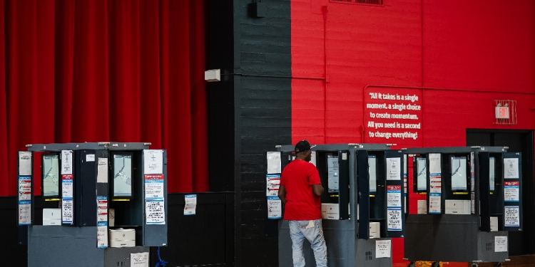 A voter casts his ballot in a polling place on Election Day in College Park, Georgia, November 5, 2024 / ©AFP