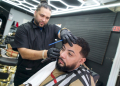 Kenny Ramirez, a Dominican-American barber who voted for Donald Trump in the US presidential election, trims hair at his barbershop in Reading, Pennsylvania on November 13, 2024 / ©AFP