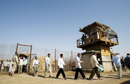 A file picture from 2006 shows freed prisoners leaving Abu Ghraib prison west of Baghdad, in Iraq. ©AFP