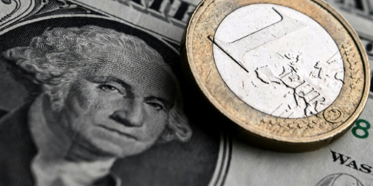 The euro hit a one-year dollar low on Tuesday, dropping below $1.06. ©AFP