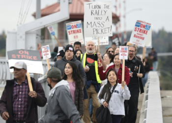 Striking workers with the International Association of Machinists and Aerospace Workers will weigh Boeing's latest offer after voting down two previous contracts . ©AFP