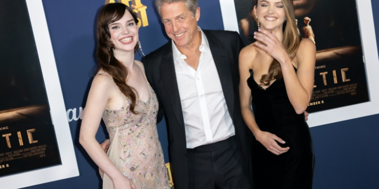 Actors (L-R) Sophie Thatcher, Hugh Grant and Chloe East attend the Hollywood premiere Of 'Heretic,' in which the two women play Mormon missionaries, while Grant plays the less innocent man they are trying to convert. ©AFP