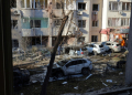 Local residents inspect damage to a residential building and cars following a missile attack in Odesa. ©AFP