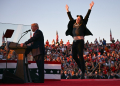 Tesla and SpaceX CEO Elon Musk exults during a Donald Trump rally in Pennsylvania in October 2024 -- the pair have become fast friends / ©AFP