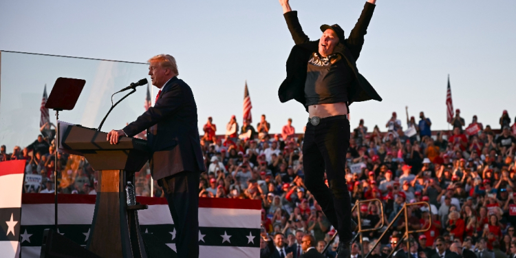 Tesla and SpaceX CEO Elon Musk exults during a Donald Trump rally in Pennsylvania in October 2024 -- the pair have become fast friends / ©AFP